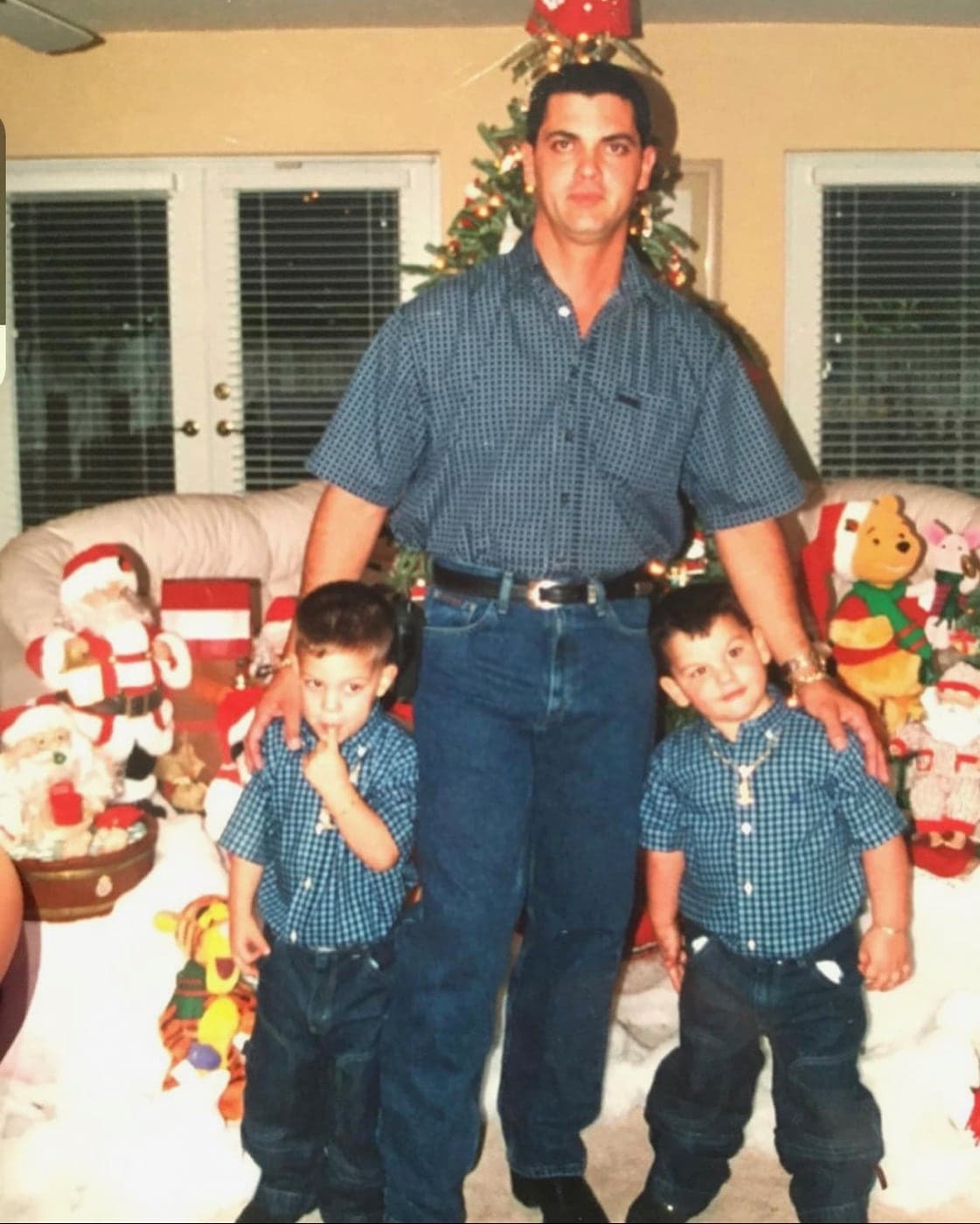 The twins, Marcos and Marc, with their father at Christmas.